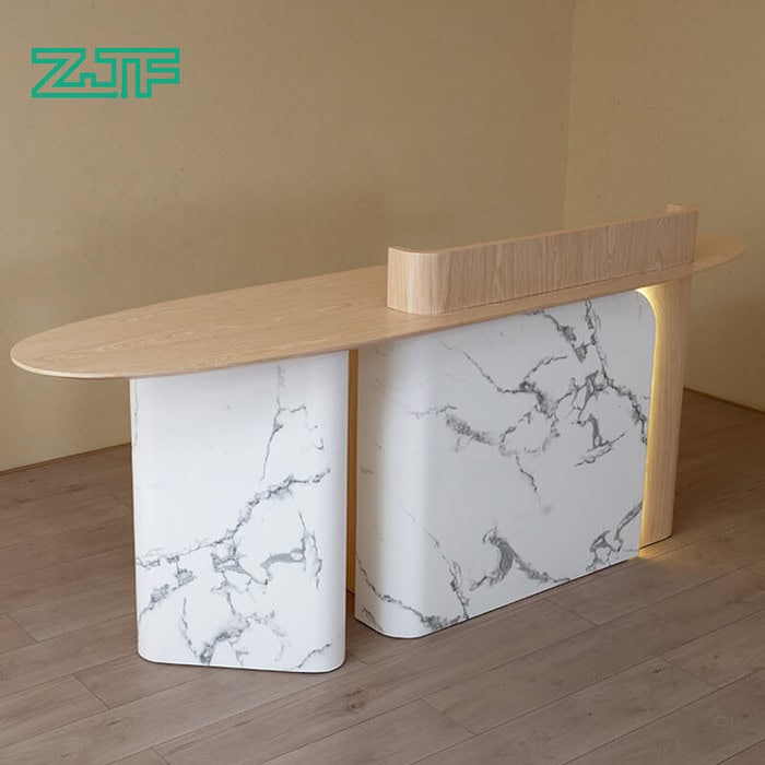 Salon reception counter with marble and wood, enhanced with LED